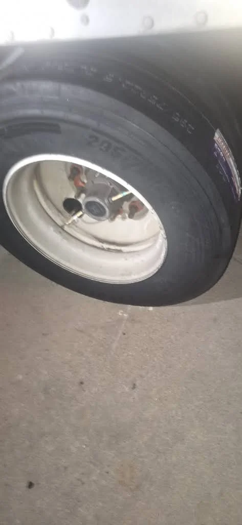 Trailer wheel and tire photographed by a customer