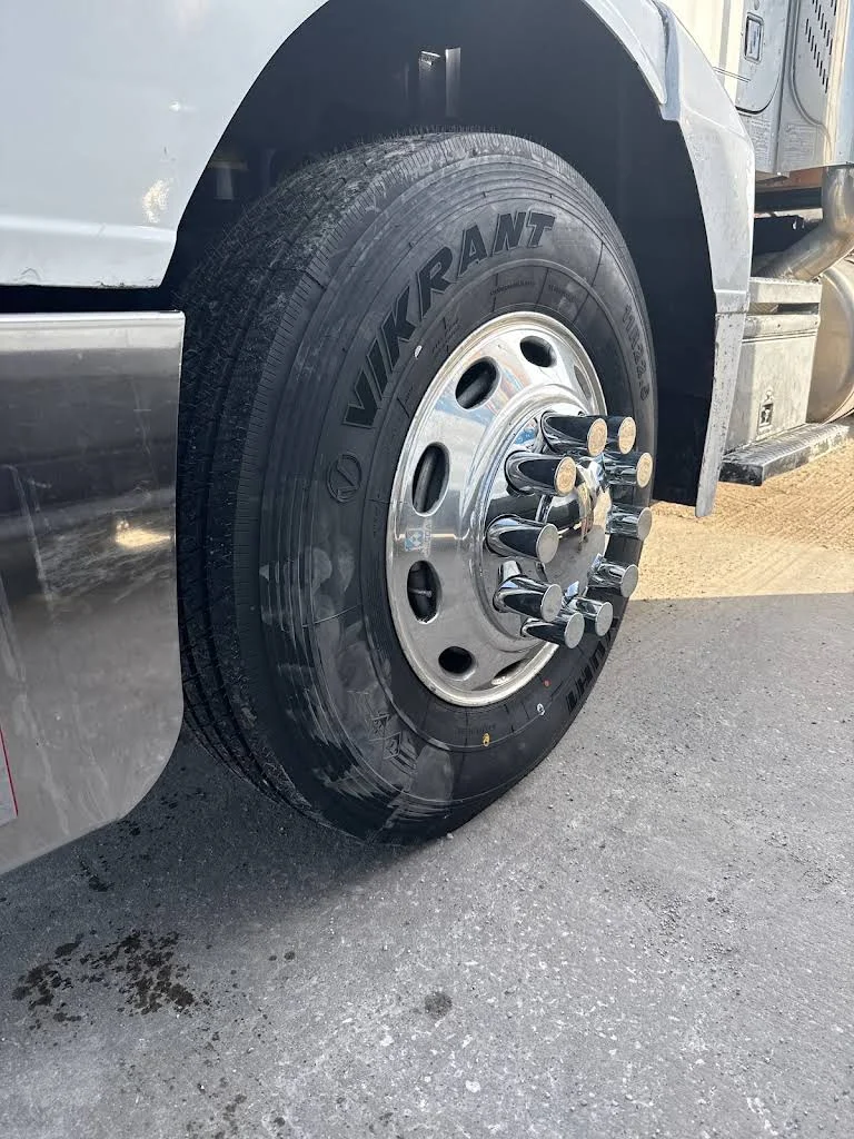 Truck steer tire photographed after roadside tire service